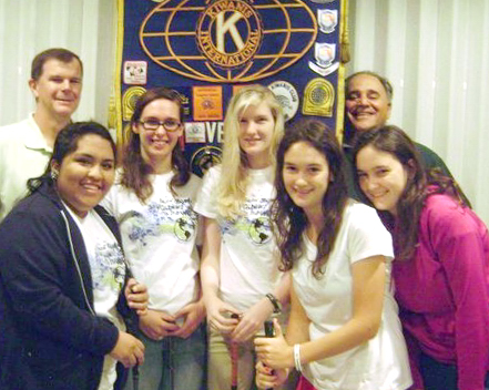 Kiwanians Kevin Brown (on left) and Al Sammartino (on right) flank Vero Beach High School Key Club officers (from left) Viri Morales, Rebecca Cosgrove, Laura Conger, Nicole McRostie and Dominique McRostie as they prepare for the Vero Kiwanis Annual Golf Tournament on Saturday, March 16 at The Club at Pointe West.