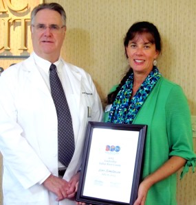 The 2013 non-for profit employee New Vision Scholarship recipient, Lori Tomlinson of the Homeless Family Center with Dr. Paul Minotty of the New Vision.