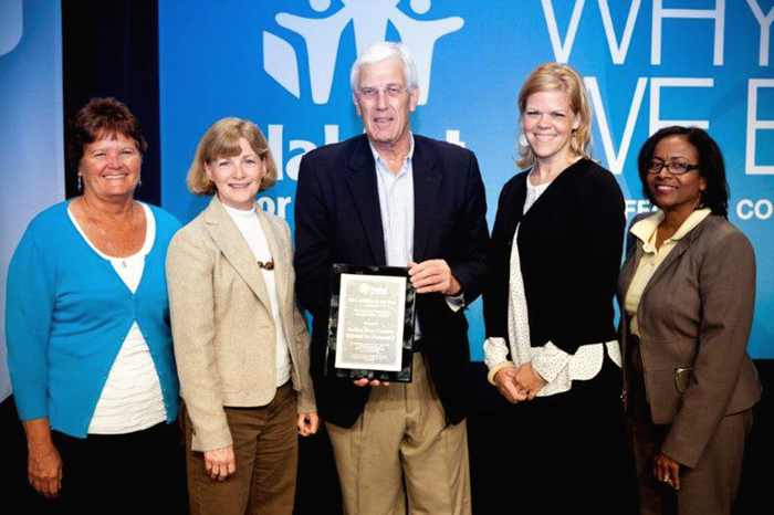 Indian River Habitat staff  with  the prestigious Affiliate of the Year Award during the 2013 Habitat for Humanity Global Conference in Atlanta. From left: Family Services Support Coordinator Debbie Parcher; Financial Controller Sara Mayo; IRHFH President/CEO Andy Bowler; Family Services Manager Lindsey Smith; and Habitat Home Center ReStore General Manager Sheradi Monroe.
