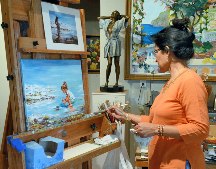 Minakshe De, working at her easel in Darby Fine Arts, which, along with the other galleries in the downtown art district, was open Friday evening to mark the beginning of Celebrate the Arts, a 10-day event promoted by the Cultural Council.  