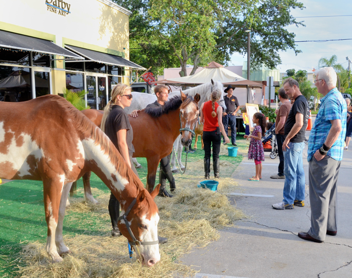 Representatives from Florida Equestrian Foundation, presented by Scarlett Stables, were horsing around in front of Darby Fine Art. The foundation offeres equine assisted therapy.