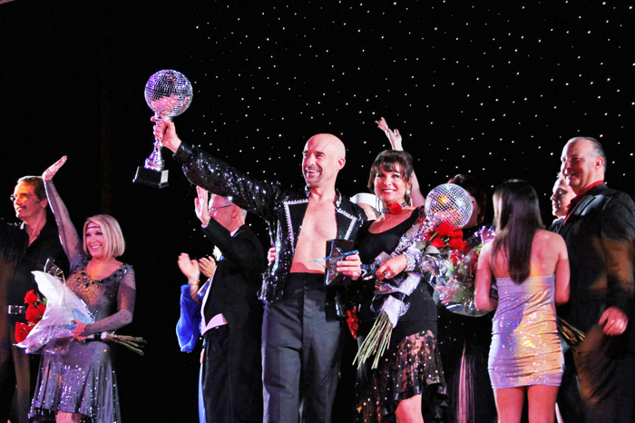 Dr. John Sarbak and Karren Walter lift up their awards as the entire cast says goodbye to the audience