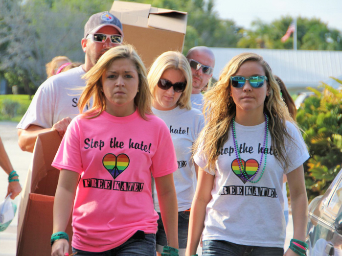 Kaitlyn Hunt with her friends and family bringing boxes of Free Kate T-shirts and bracelets to a rally at Sebastian Riverview Park.  