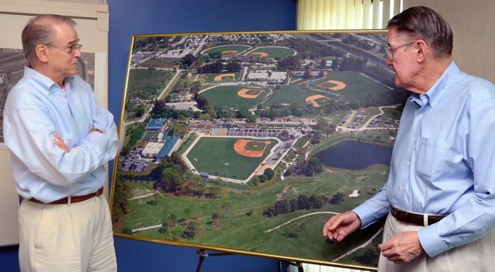 Craig Callan and Peter O'Malley review an aerial photograph of the Vero Beach Sports VIllage