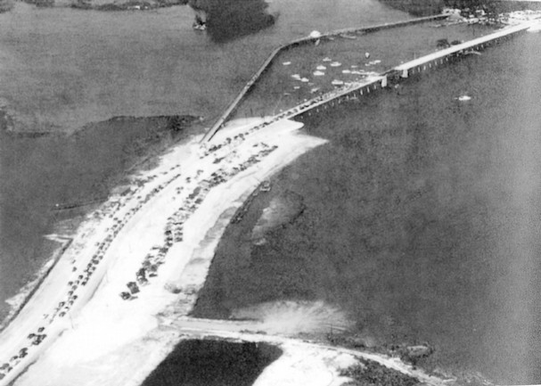 The original Barber Bridge was dedicated in 1951.  The concrete draw bridge replaced original bridge between the barrier island and the mainland built in the early 1920s.  