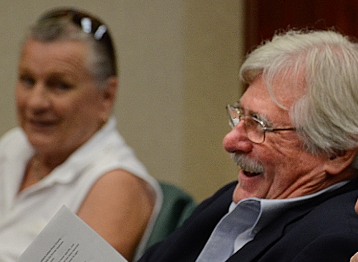 Rosemarie Wilson and Charlie Wilson laughing at Councilman Richard Winger's accounting of the $94 million in value the OUC is set to receive from the sale of Vero Electric.