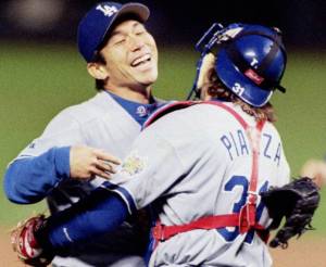 The Warrior: Hideo Nomo is hugged by Dodgers catcher Mike Piazza after thowing a no-hitter at Coors Field in 1996.