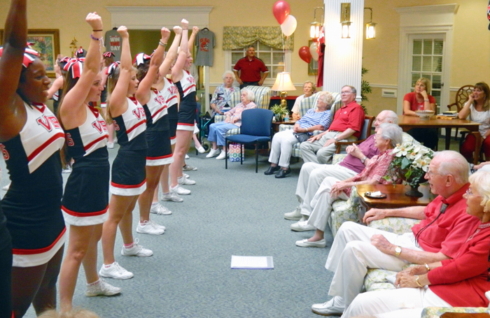 The Vero Beach High School’s cheer squad attracted a large crowd of staff members and residents at Indian River Estates