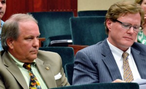 John Carroll with his attorney, Tom Tierney. Among his credentials, Carroll said he was successful working in Texas to help Wal-Mart overcome local zoning regulations. In a letter to City Attorney Wayne Coment, Tierney warned that he would, on behalf of his client, sue the City for the cost of appealing the Code Enforcement Board's decision.