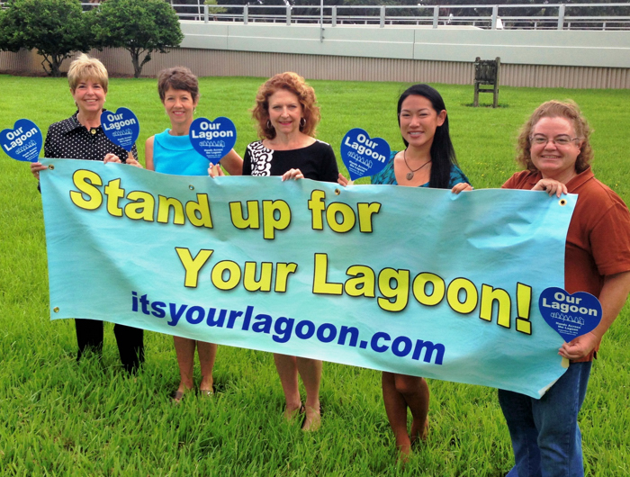 Indian River County Chamber of Commerce Executive Director Penny Chandler, The Lagoon Coalition founder Judy Orcutt, Indian River Community Foundation Executive Director Kerry Bartlett, Florida Institute of Technology graduate student Nancy Pham, and Indian River Lagoon National Estuary Program Education Coordinator Kathy Hill prepare for Hands Across The Lagoon at the Merrill P. Barber Bridge in Vero Beach.
