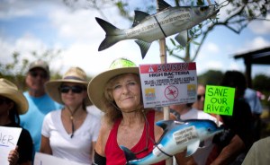 Protesters greeted Gov. Rick Scott as he toured the newly polluted areas - J PAT CARTER/ASSOCIATED PRESS
