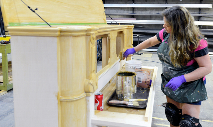 Dusty Terrell painting what will be the visual motif in Riverside Theatre's opening play of the season, "I Love a Piano."