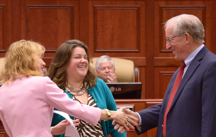 City Clerk Tammy Vock congratulates Amelia Graves and Richard Winger after they were sworn into office Friday, November 8. Winger was later elected by the Council to serve as mayor.