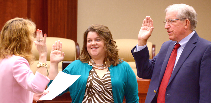 City Clerk Tammy Vock administers the oath of office to Amelia Graves and Richard Winger. Winger was later unanimously elected by his fellow council members to serve as mayor.