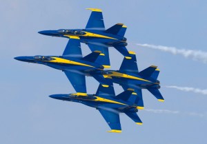 Four Blue Angels fly in formation.