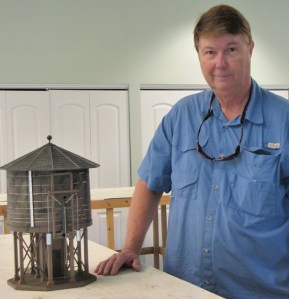 Train volunteer Peter Tyson and his newly created water tower