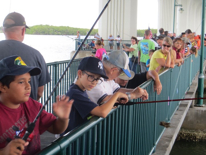 families enjoy a morning of fishing and lunch provided at no charge by the Kiwanis Club of Vero-Treasure Coast
