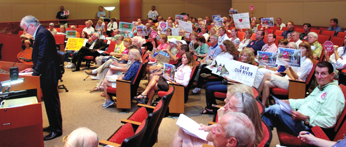 Brendan Burke presenting petition with 2200 names protesting plan to upgrade Oslo Road boat ramp. PHOTO: David Bazinet