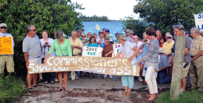 Opponents of the Indian River County Commission's plan to expand the Oslo boat ramp, located near sensitive seagrass beds, gathered yesterday at the site to appeal to the Commission to reconsider its decision to go ahead with the $1 million project. PHOTO BY THOMAS HARDY 