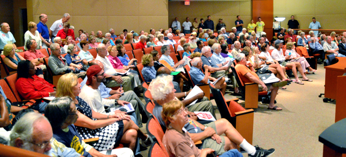 More than 100 opponents of the proposed Oslo Road boat ramp packed the County Commission chambers Tuesday.