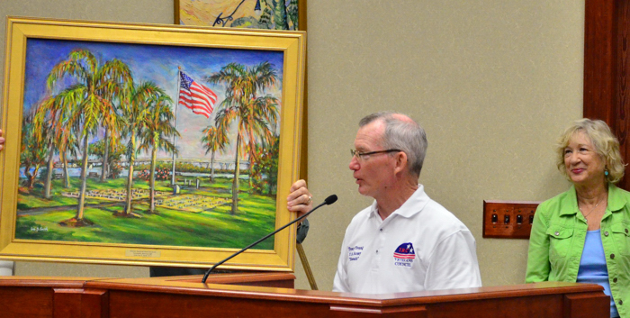 At Tuesday's City Council meeting, the Veteran's Council representative Col. Tony Young, retired, presented a painting by local artist, Lee Smith.  Smith titled her work, "Veteran's Memorial Island: Cenotaphs at Sunrise." According to City Clerk Tammy Vock, Smith's painting will be displaced in the Council chambers.