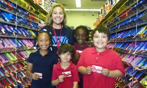 Indian River Academy Principal Diane Fannin and her students benefit from the Payless Gives Shoes 4 Kids program.