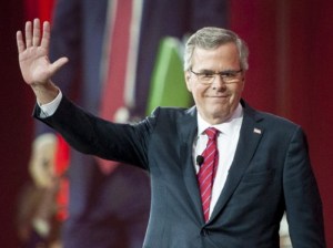 Former Florida governor Jeb Bush waves to the crowd as he arrives to address CPAC on Friday. (Pete Marovich/European Pressphoto Agency)