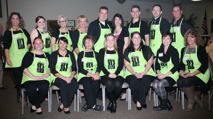 Volunteers take a break from their busy night at the HFC Top Chef Qualifying Event