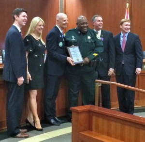 Indian River County Sheriff's Deputy Teddy Floyd with Gov. Rick Scott and the members of the Florida Cabinet.