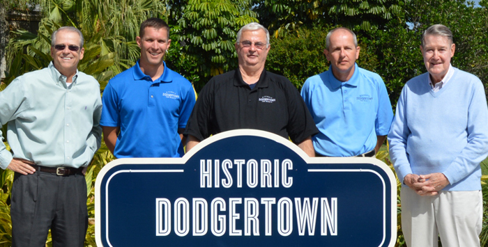  (L-R) Craig Callan, Brady Ballard, Steve Snure, Jeff Biddle and Peter O’Malley pose in front of the Conference Center sign at Historic Dodgertown.