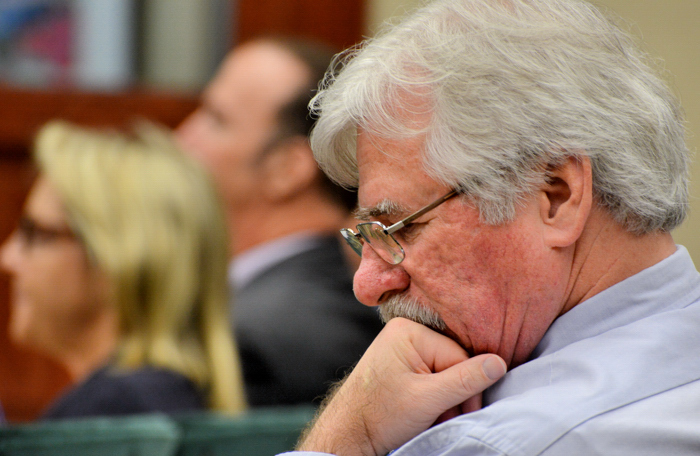 Former Vero Beach City Council candidate and utility activist Charlie Wilson during a council meeting. In the background are two representative of Florida Power & Light, including FPL External Affairs Manager Amy Brunjes. Former island weekly reporter Eileen Kelly once reported Wilson was summoned to a city council meeting by a representative of Florida Power & Light. 