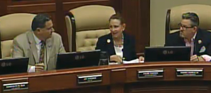 Mayor Jay Kramer sparing with Council members Pilar Turner and Harry Howle